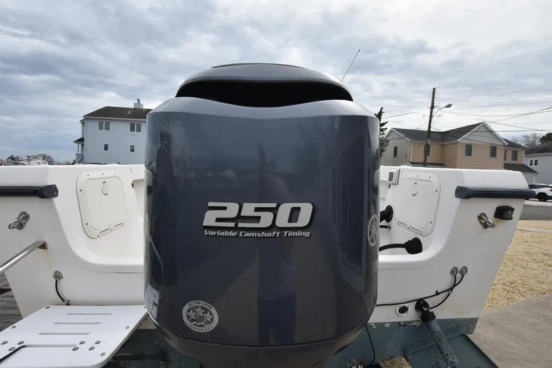 Slide: The Image of 1994 Pursuit 2350 boat with a 250 horsepower outboard motor. - 8