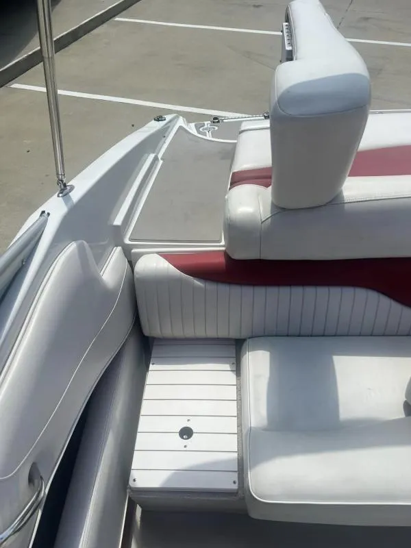 Slide: The Image of Interior seating of a 2016 Crownline Boats 21SS with white and red upholstery. - 16