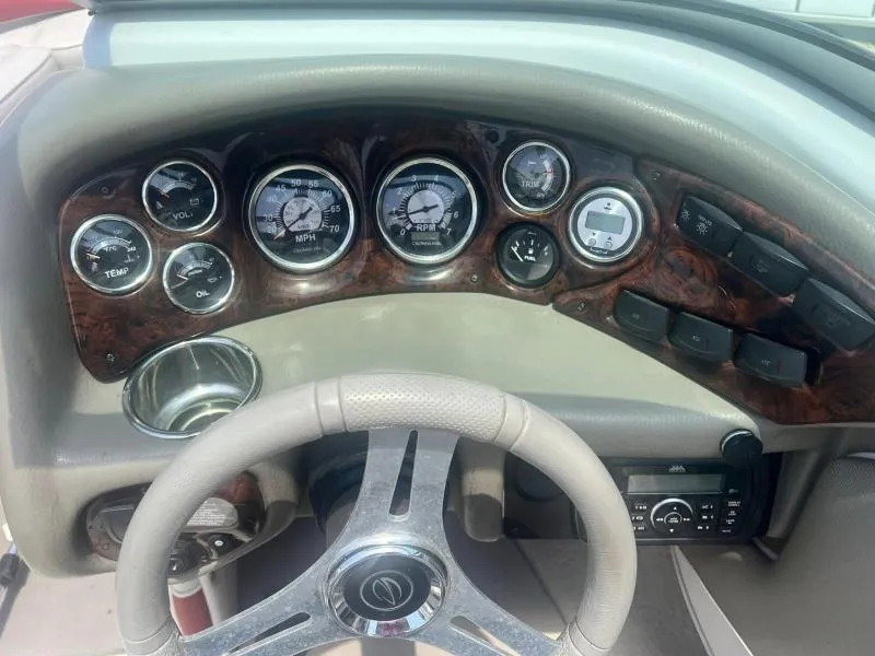 Slide: The Image of Dashboard of a 2016 Crownline Boats 21SS with gauges and controls. - 18