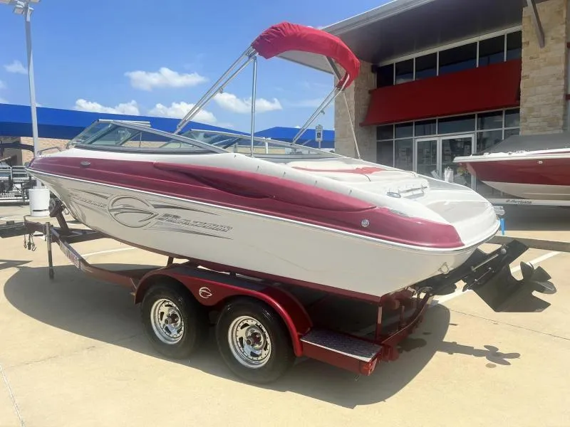 Slide: The Image of 2016 Crownline Boats 21SS on a red trailer, parked outside a dealership. - 3