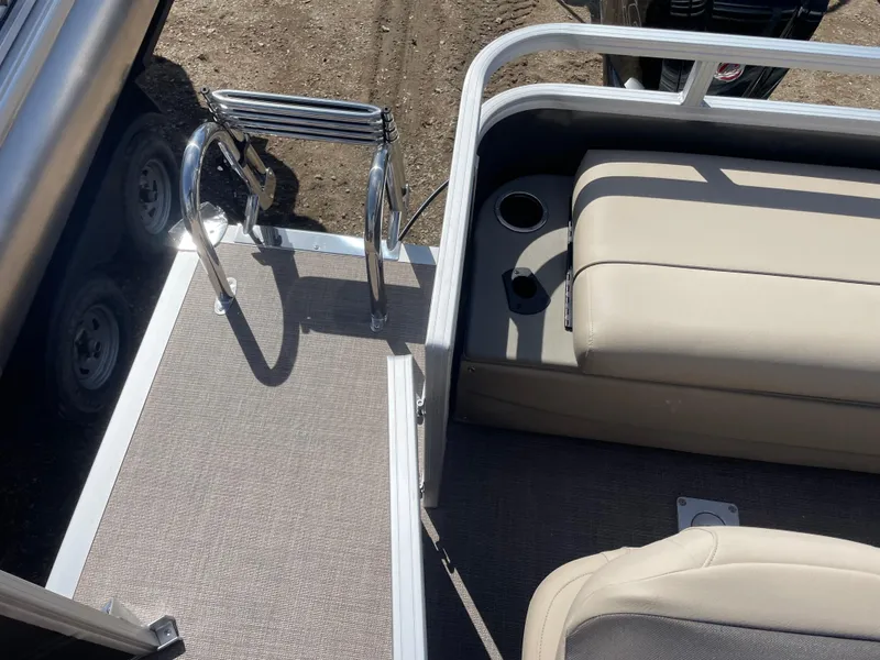 Slide: The Image of 2024 Sun Tracker Fishin' Barge 22 DLX, rear seating and ladder view. - 16