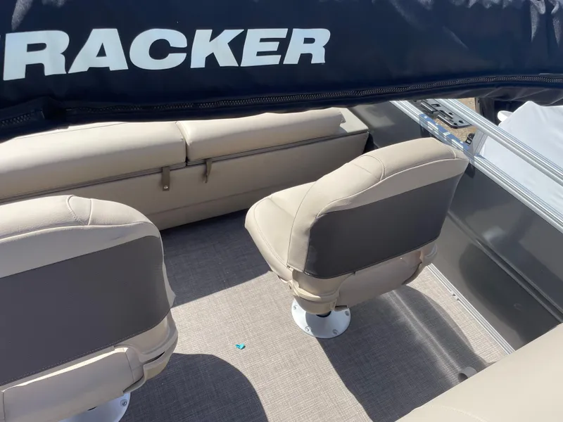 Slide: The Image of 2024 Sun Tracker Fishin' Barge 22 DLX interior seating area. - 17