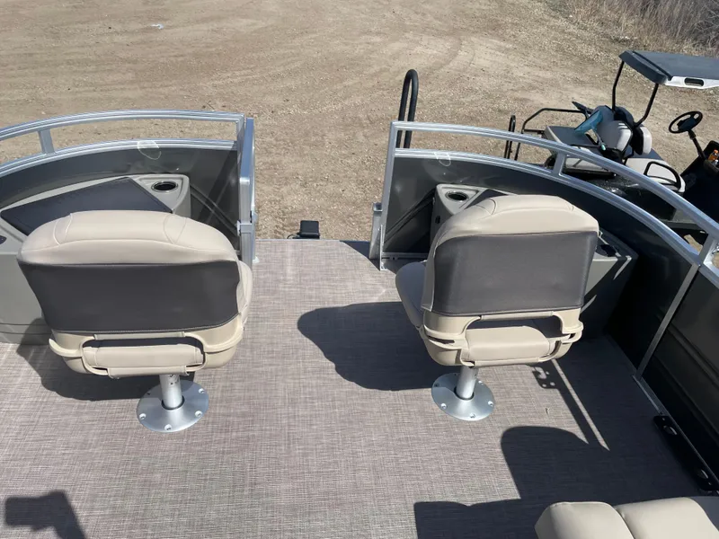 Slide: The Image of 2024 Sun Tracker Fishin' Barge 22 DLX with two fishing seats on deck. - 18