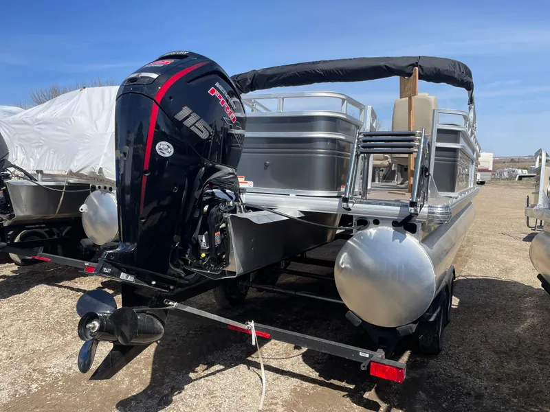 Slide: The Image of 2024 Sun Tracker Fishin' Barge 22 DLX pontoon boat with outboard motor. - 4