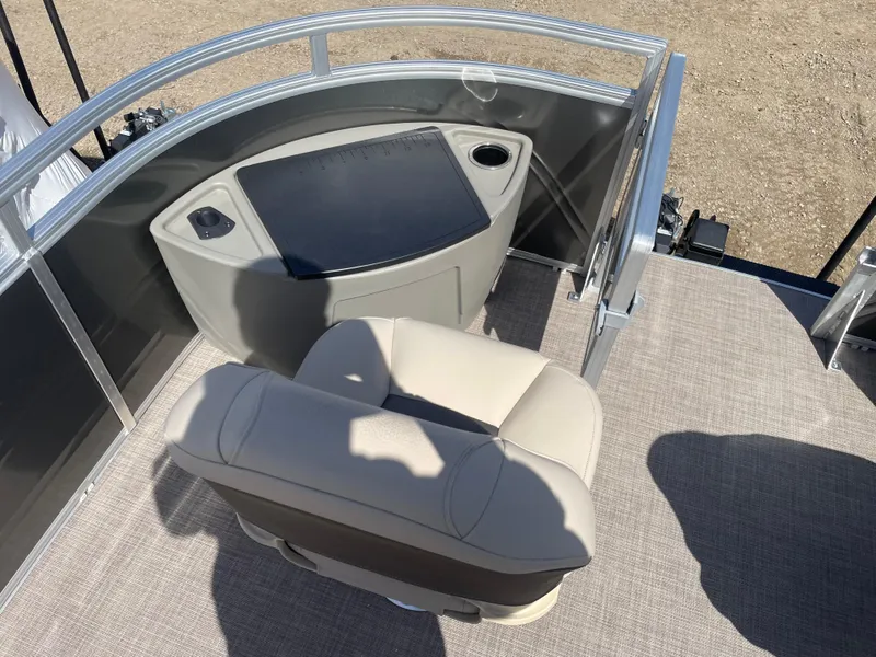 Slide: The Image of 2024 Sun Tracker Fishin' Barge 22 DLX helm station with captain's chair. - 6