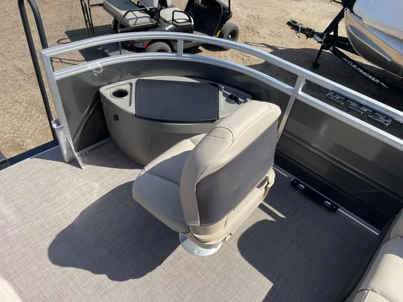 Slide: The Image of 2024 Sun Tracker Fishin' Barge 22 DLX fishing station with swivel chair and storage. - 7