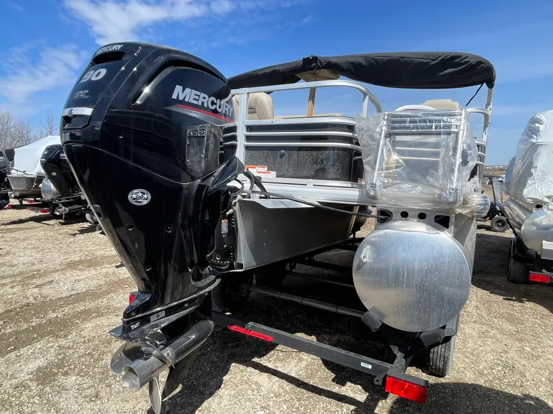 Slide: The Image of 2023 Sun Tracker SportFish 20 DLX pontoon boat with Mercury outboard motor. - 4