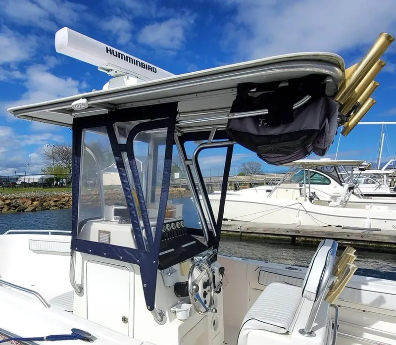 Slide: The Image of 2006 Blue Fin Pro Fish C/C boat with Humminbird radar, docked under blue sky. - 2