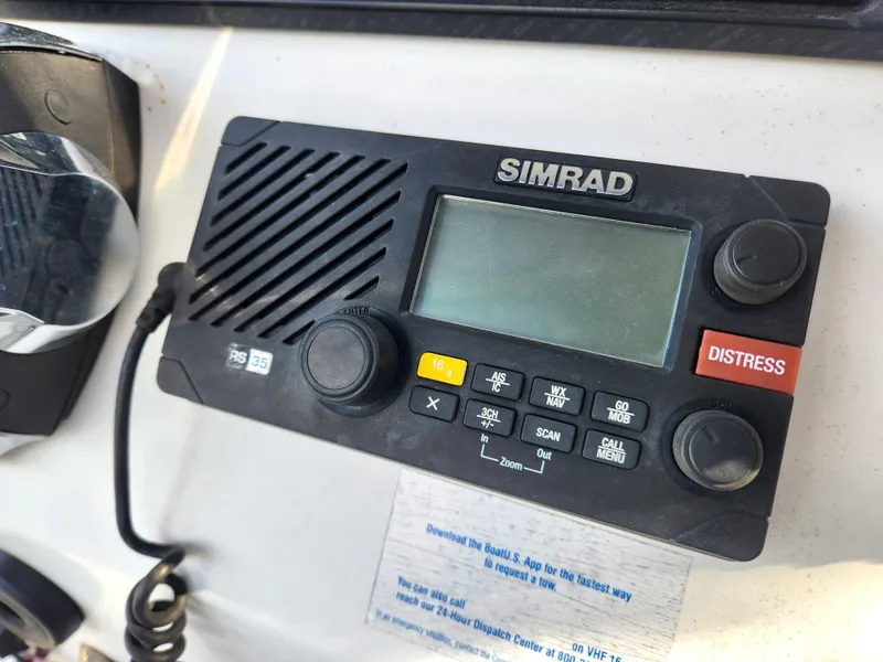 Slide: The Image of Simrad marine radio on 2006 Blue Fin Pro Fish C/C boat dashboard. - 27