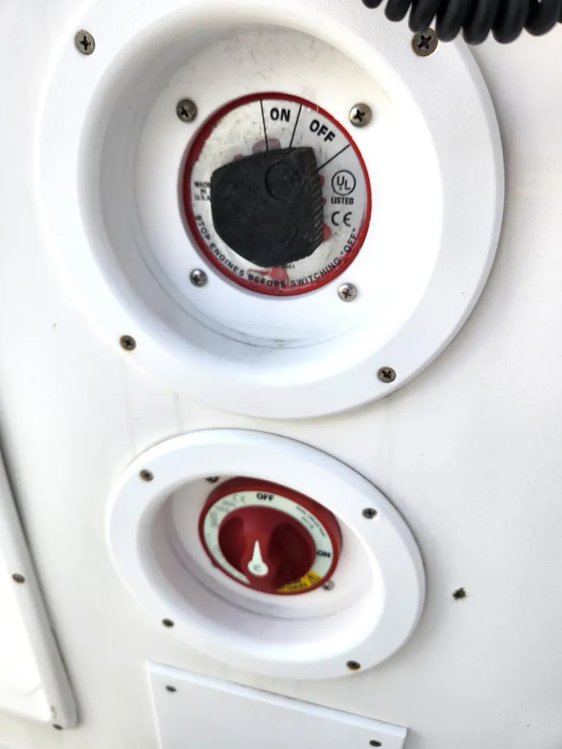 Slide: The Image of Close-up of control switches on a 2006 Blue Fin Pro Fish C/C boat. - 28