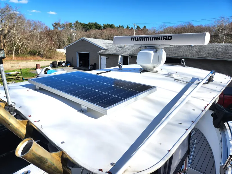 Slide: The Image of 2006 Blue Fin Pro Fish C/C boat with solar panel and radar equipment on the roof. - 34