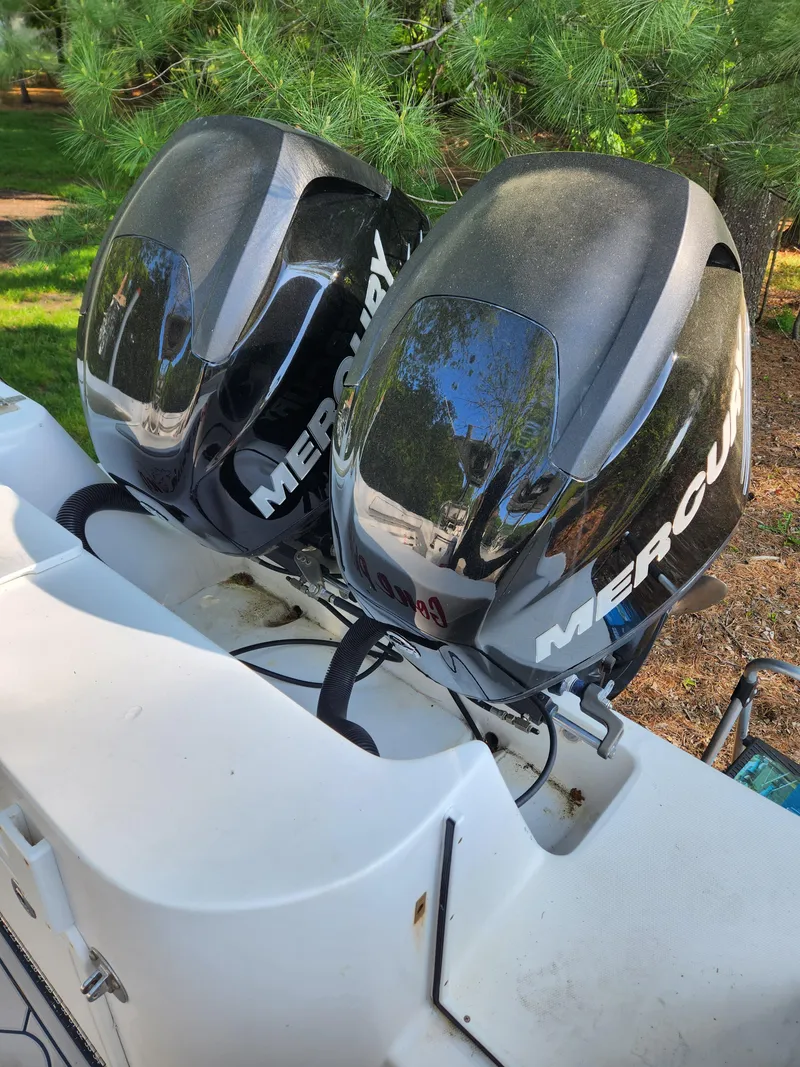 Slide: The Image of 2006 Blue Fin Pro Fish C/C boat with dual Mercury outboard motors. - 9