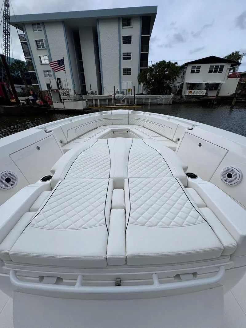 Slide: The Image of 2023 Intrepid 427 Nomad FE boat with luxurious white seating. - 14