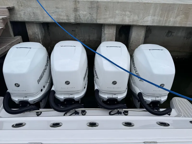 Slide: The Image of Four powerful outboard engines on a 2023 Intrepid 427 Nomad FE boat. - 19