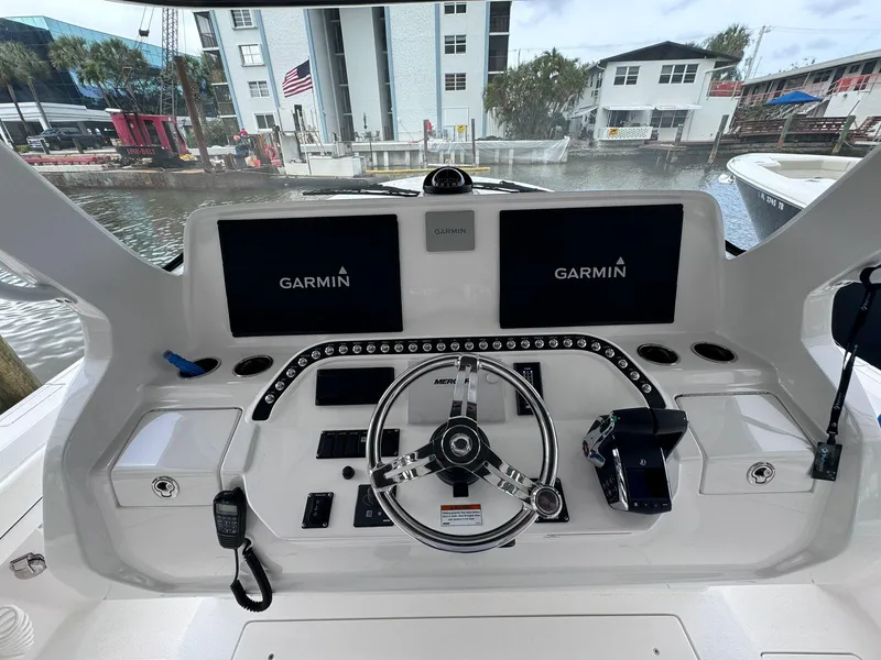 Slide: The Image of 2023 Intrepid 427 Nomad FE helm with dual Garmin displays and advanced controls. - 4
