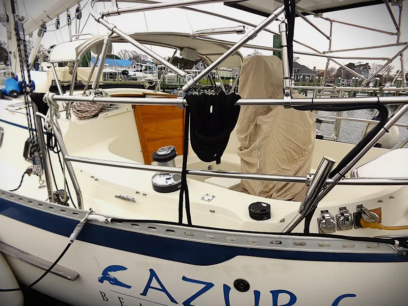 Slide: The Image of Pacific Seacraft 40 sailboat, 2005 model, docked with covered cockpit and visible rigging. - 19