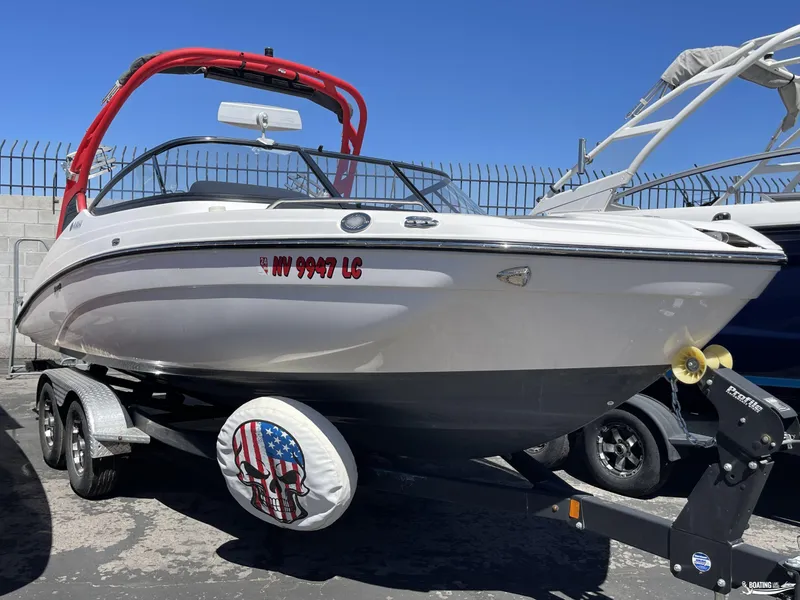Slide: The Image of 2020 Yamaha Boats 212X on trailer with red wakeboard tower. - 0