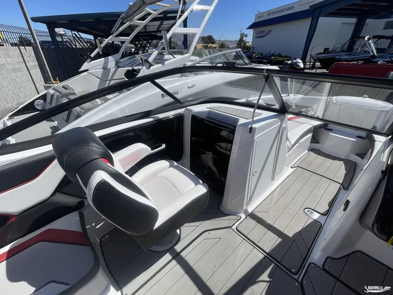 Slide: The Image of 2020 Yamaha Boats 212X interior, featuring sleek seating and modern design. - 5