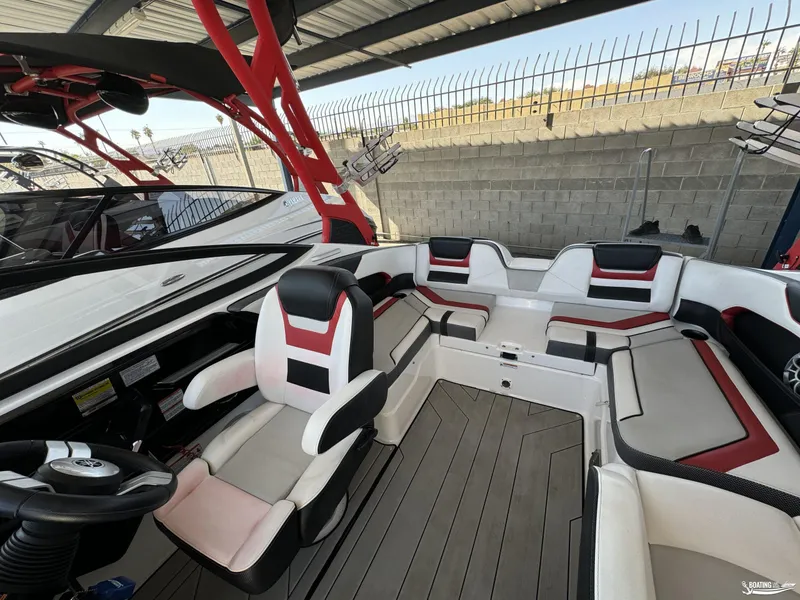 Slide: The Image of 2020 Yamaha Boats 212X interior with modern seating and sleek design. - 9