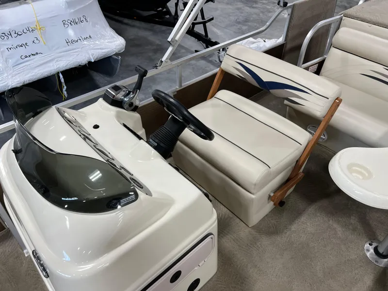 Slide: The Image of 2013 PlayCraft 2400 Clipper boat interior with steering console and seating. - 10