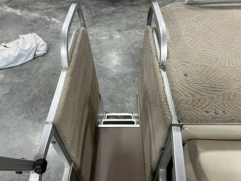 Slide: The Image of 2013 PlayCraft 2400 Clipper boat interior with carpeted steps and seating. - 11