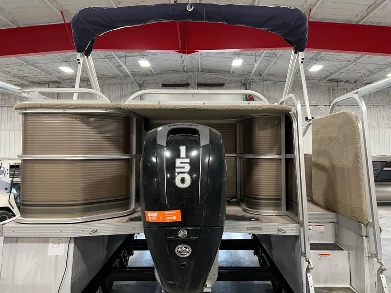 Slide: The Image of 2013 PlayCraft 2400 Clipper pontoon boat with 150 HP engine in a showroom. - 5