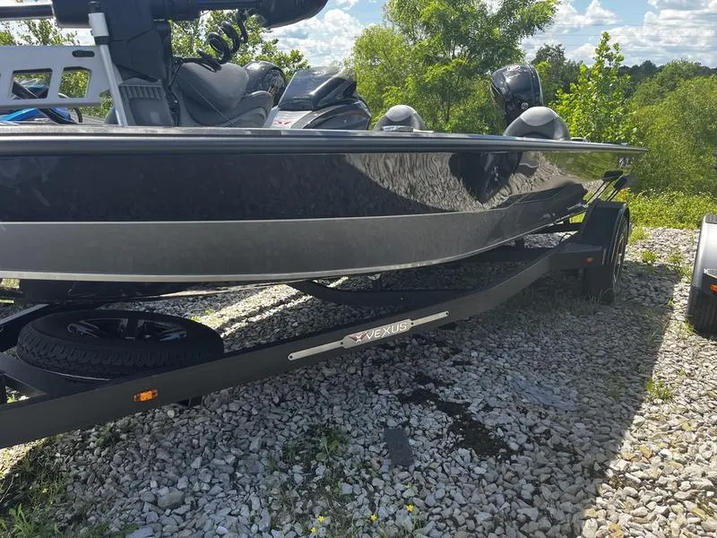 The Image of 2024 Vexus AVX 1880 boat on a trailer, parked on gravel. - 0