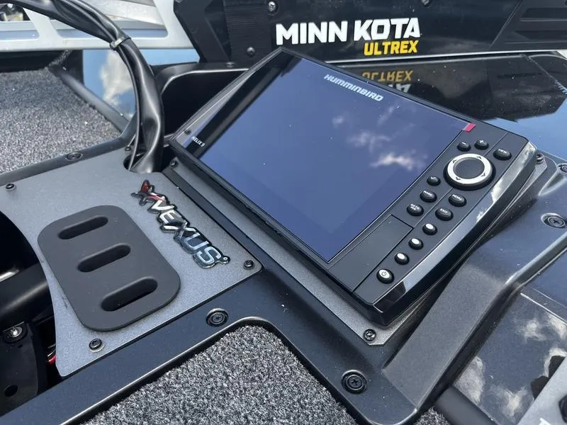 Slide: The Image of 2024 Vexus AVX 1880 boat dashboard with Humminbird and Minn Kota Ultrex systems. - 2