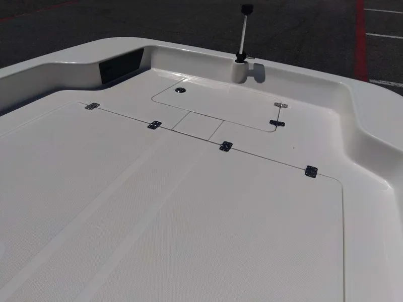 Slide: The Image of 2024 Mako Pro Skiff 17 CC boat deck with storage compartments. - 10