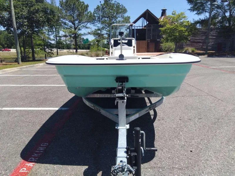 Slide: The Image of 2024 Mako Pro Skiff 17 CC on trailer in parking lot. - 7