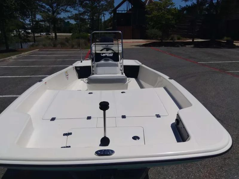 Slide: The Image of 2024 Mako Pro Skiff 17 CC in a parking lot, front view. - 8
