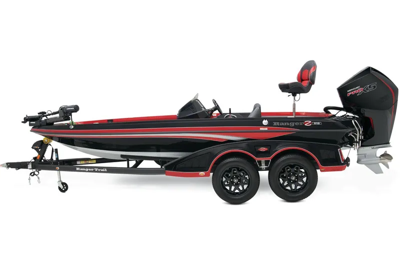 Slide: The Image of 2024 Ranger Z519 Ranger Cup Equipped boat on trailer in outdoor setting. - 2