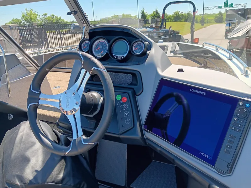 Slide: The Image of 2024 Ranger 621FS Ranger Cup Equipped boat dashboard with steering wheel and Lowrance HDS display. - 4
