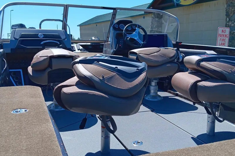 Slide: The Image of 2024 Ranger 621FS Ranger Cup Equipped boat interior with seating and dashboard. - 6