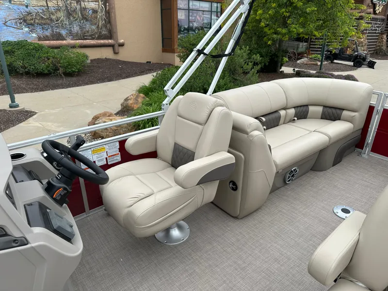 Slide: The Image of 2024 Sun Tracker Party Barge 22 XP3 interior with plush seating and modern helm. - 7
