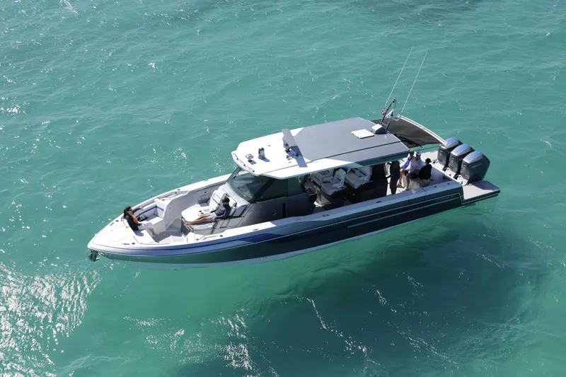Slide: The Image of 2025 Formula 457 Center Console Sport boat cruising on turquoise waters. - 4