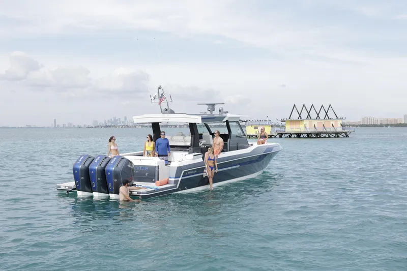 Slide: The Image of 2025 Formula 457 Center Console Sport boat with people enjoying the water. - 5