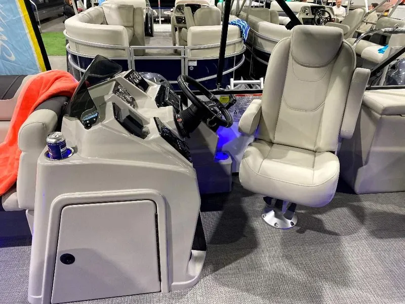 Slide: The Image of 2024 SunChaser GENEVA 22 SB boat interior with captain's chair and control console. - 12