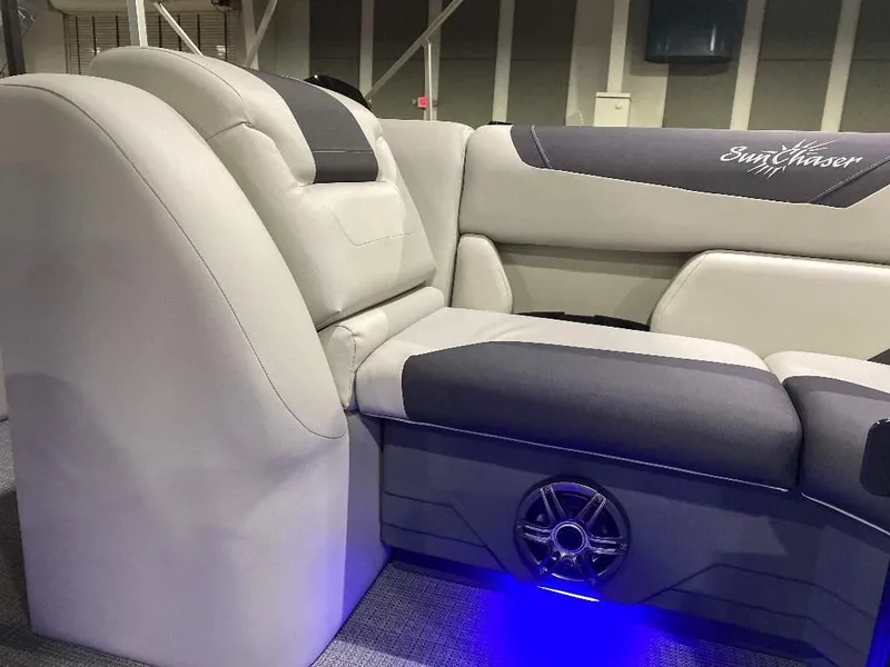 Slide: The Image of 2024 SunChaser GENEVA 22 SB boat interior with plush seating and blue LED lighting. - 15