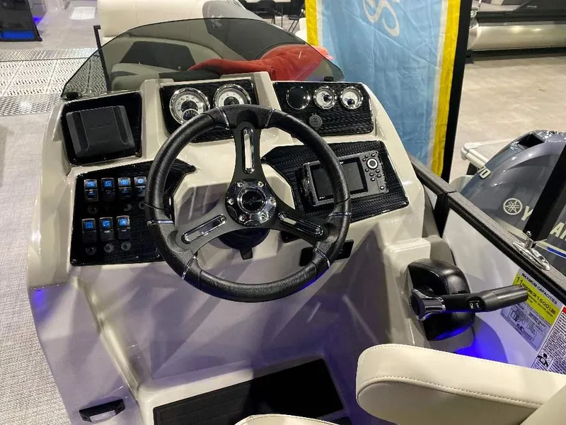Slide: The Image of 2024 SunChaser GENEVA 22 SB boat dashboard with steering wheel and control panel. - 5