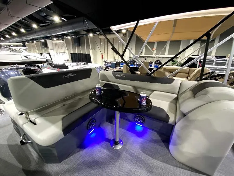 Slide: The Image of 2024 SunChaser GENEVA 22 SB pontoon boat interior with seating and table. - 9
