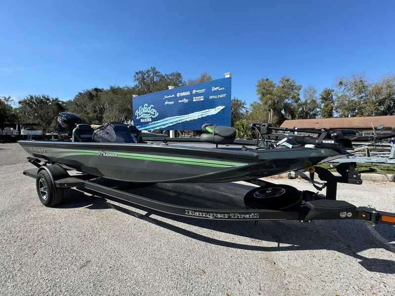 The Image of 2024 Ranger RT188P fishing boat on trailer in outdoor lot. - 0