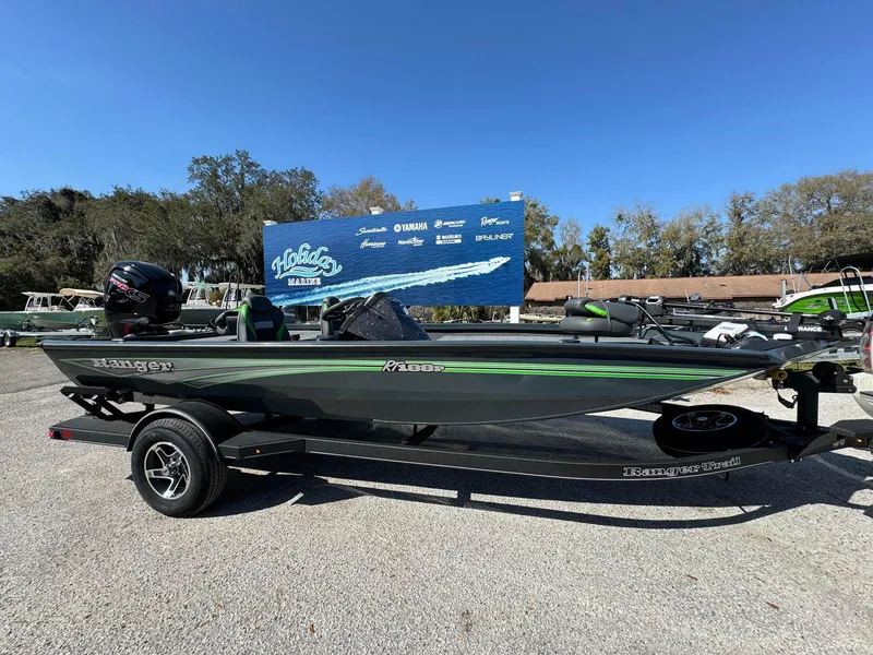 Slide: The Image of 2024 Ranger RT188P fishing boat on a trailer at a marina. - 5