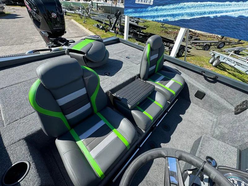 Slide: The Image of 2024 Ranger RT188P boat interior with gray and green seats. - 7