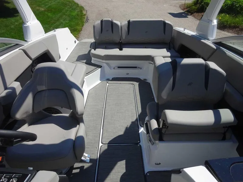 Slide: The Image of 2024 Four Winns H6 boat interior with gray seating and modern design. - 10