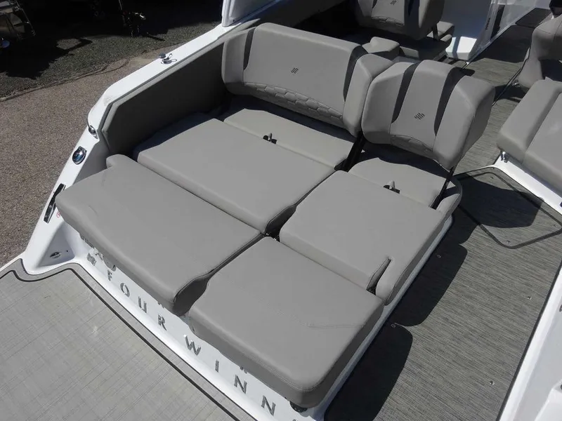 Slide: The Image of 2024 Four Winns H6 boat with spacious gray seating area. - 13