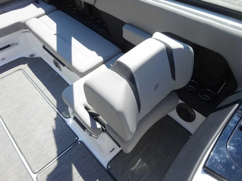 Slide: The Image of 2024 Four Winns H6 boat interior with gray seating and modern design. - 14