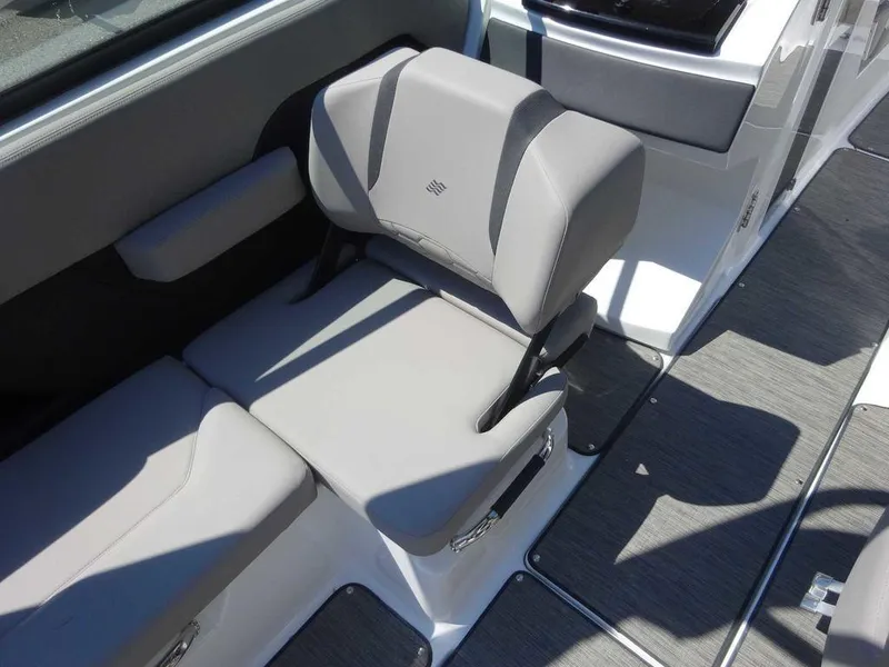 Slide: The Image of 2024 Four Winns H6 boat interior seating with gray upholstery and modern design. - 17