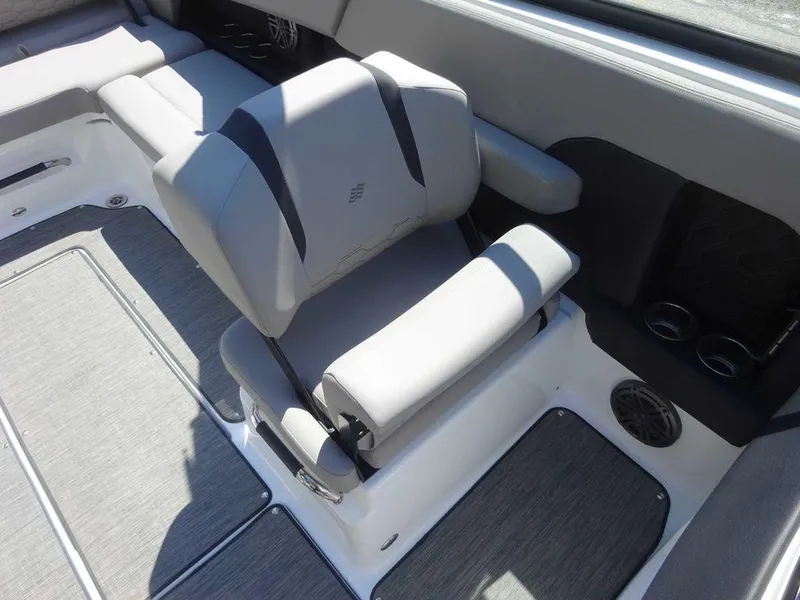 Slide: The Image of 2024 Four Winns H6 boat interior with gray seating and modern design. - 18