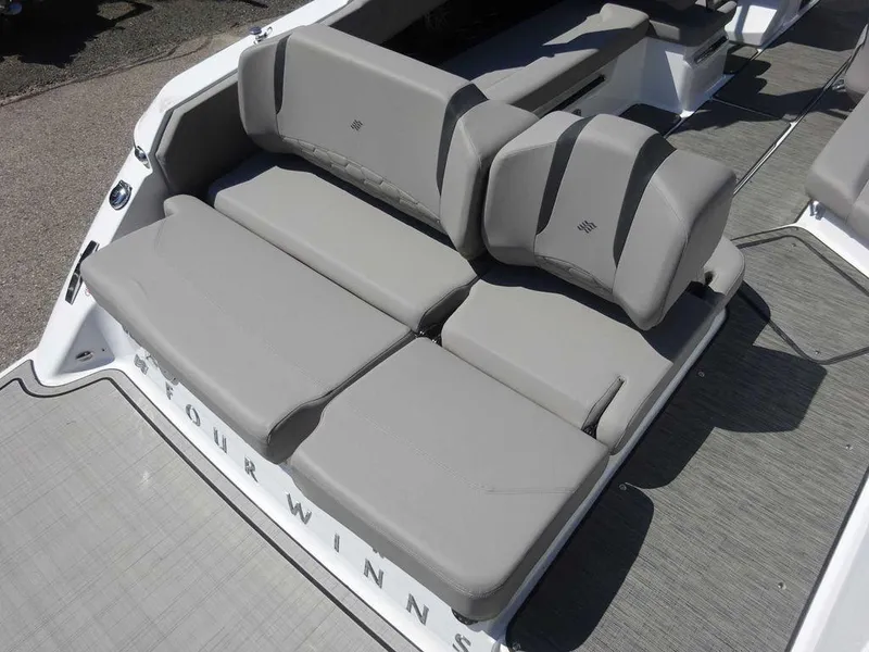 Slide: The Image of 2024 Four Winns H6 boat with gray cushioned seating. - 19